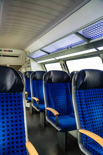 istock Row of blue seats in train preparing for departure 1187807502