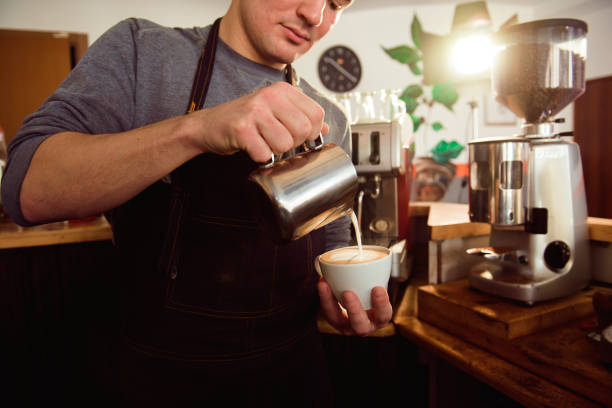 istock Coffee Latte Barista making pattern in a cup of coffee shop. 1187807605