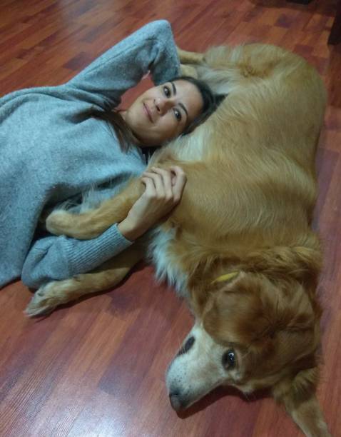 istock Young women with dog 1187808933