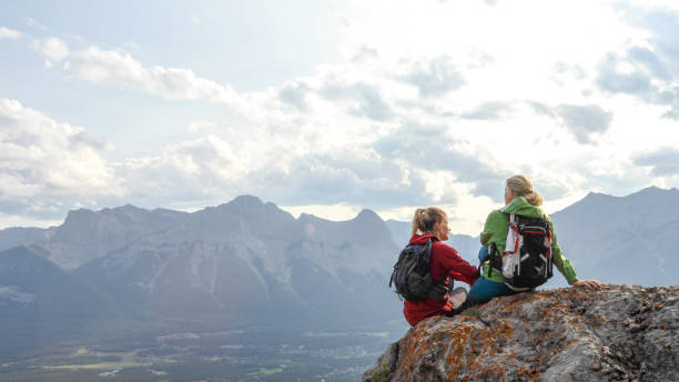 istock Female mountaineers traverse mountain summit 1187808976