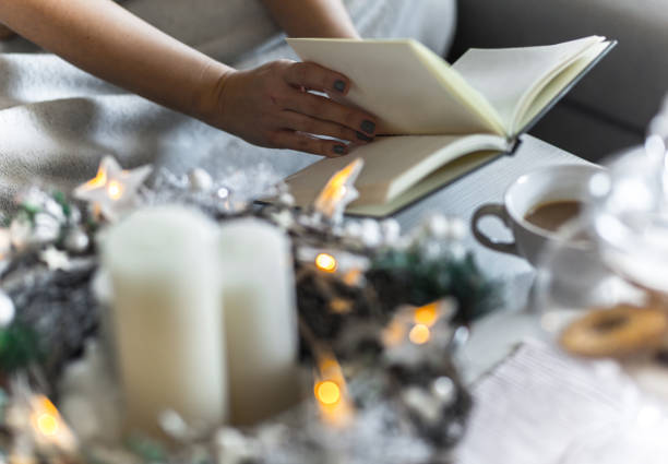 istock Cozy Christmas morning in bed-reading book 1187810752