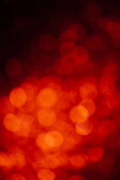 istock fiery abstract background with bokeh defocused lights 1187812103