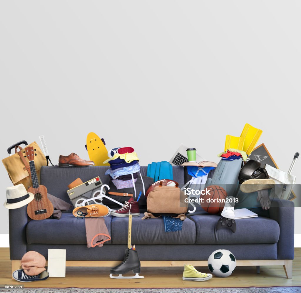 Large leather sofa with mess Large leather sofa with a bunch of different things Messy Stock Photo