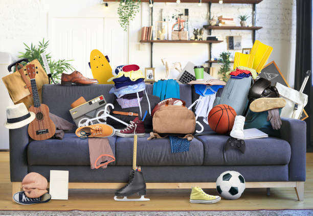 Large leather sofa with mess stock photo