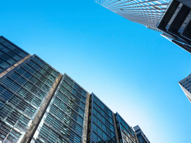 istock Towering glass facade of skyscraper and sky 1187814110