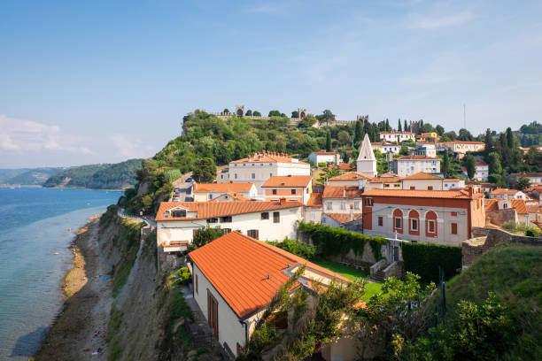 Panoramic view of houses and old city walls of Piran stock photo