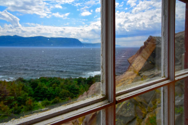 istock As Seen Through A Window, Lobster Cove Head Lighthouse, Newfoundland, Canada 1187814184
