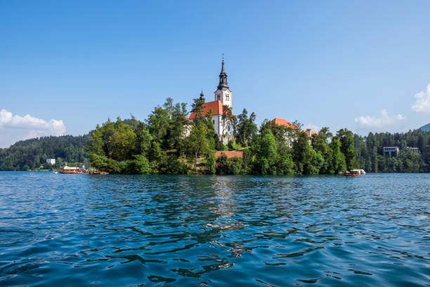 View of Bled Island with church dedicated to the Assumption of Mary stock photo