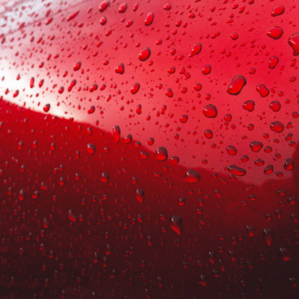 istock Drops of rain in a colored background 1187816872