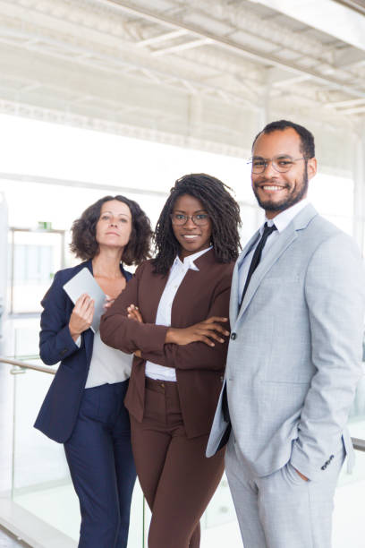 istock Happy confident professional team posing for camera 1187818188