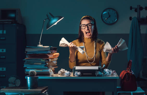 istock Exhausted secretary working at night in the office 1187818223