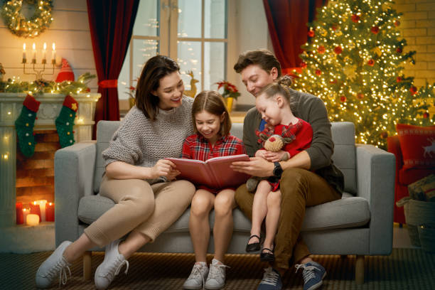 istock family near Christmas tree 1187819483