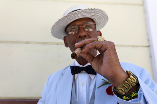 Havana, Cuba, May 9, 2017: stylish man dressed in colorful suit