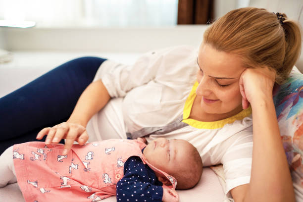 istock Mother with her newborn baby 1187820837