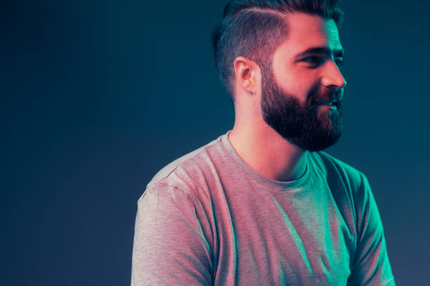 istock Neon portrait of a young attractive man 1187821178