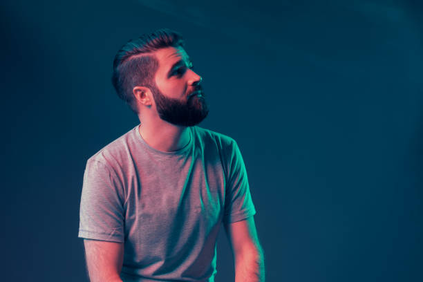 istock Neon portrait of a young attractive man 1187821194