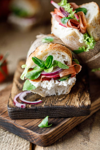 istock Fresh sandwich with tomatoes, jamon, corn salad and philadelphia cheese 1187822155