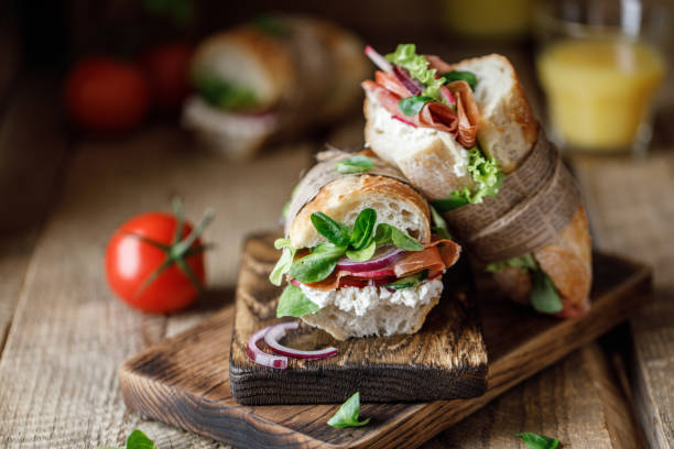 istock Fresh sandwich with tomatoes, jamon, corn salad and philadelphia cheese 1187822208