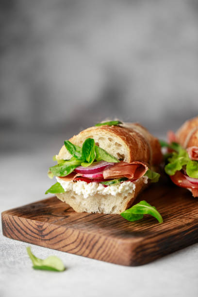 istock Fresh sandwich with tomatoes, jamon, corn salad and philadelphia cheese 1187822220