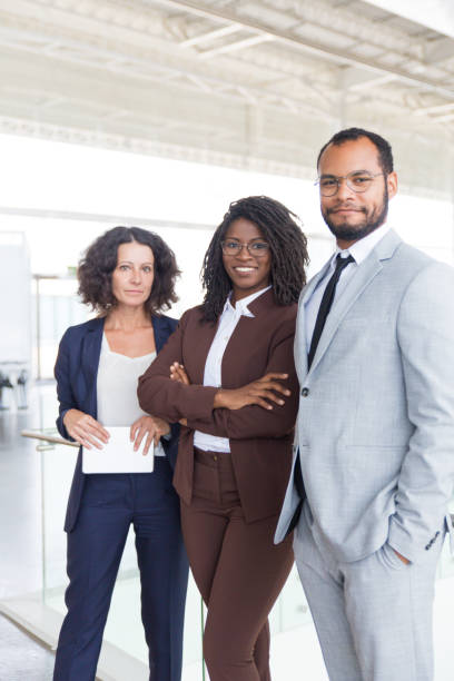 istock Happy successful business team posing for camera 1187823761