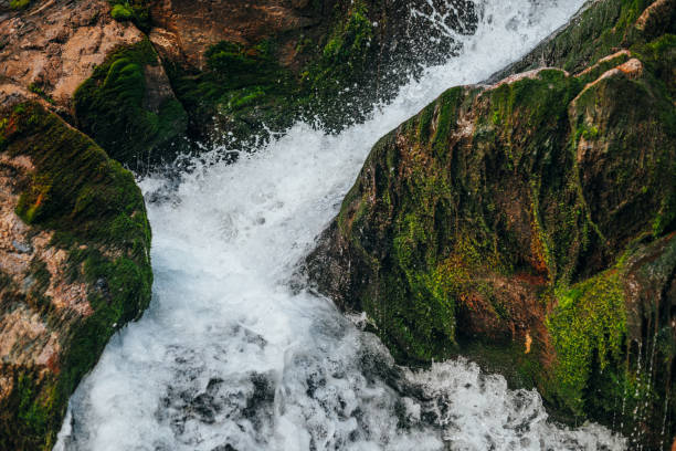 istock Waterfall near mossy rocks. 1187824503