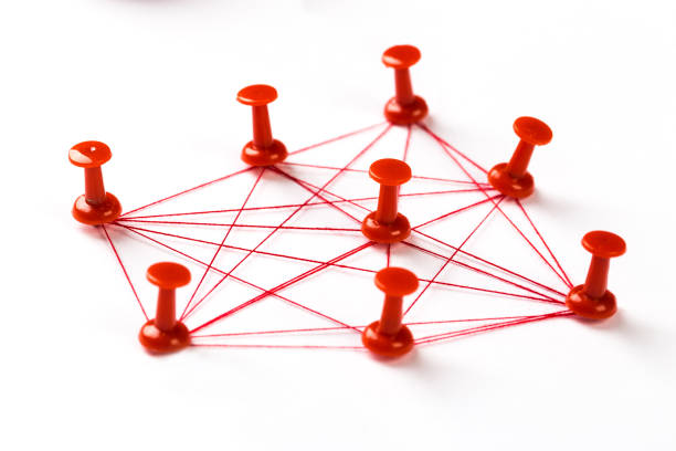 istock Network connection made from push pins and thread on blue background, close-up. 1187825972