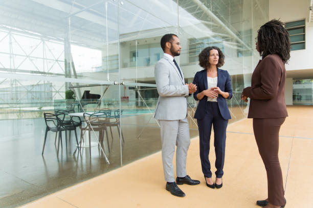 istock Interracial business team discussing project 1187827598