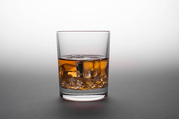 istock Whiskey glass. Isolated on white with reflection 1187832535