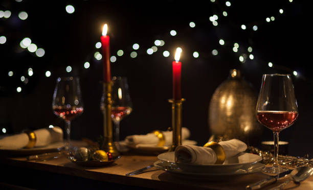 istock Christmas dinner with romantic candlelight and Christmas decorations 1187834755