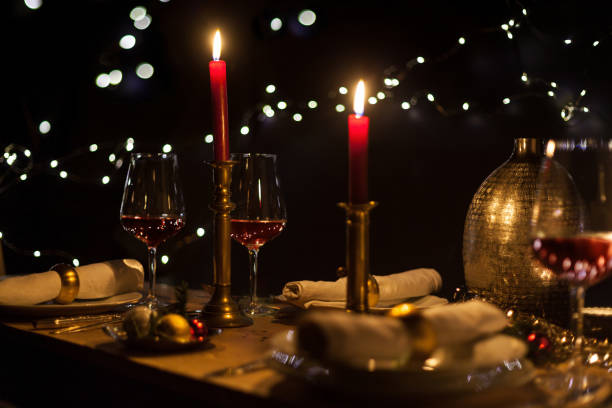 istock Christmas dinner with romantic candlelight and Christmas decorations 1187836223