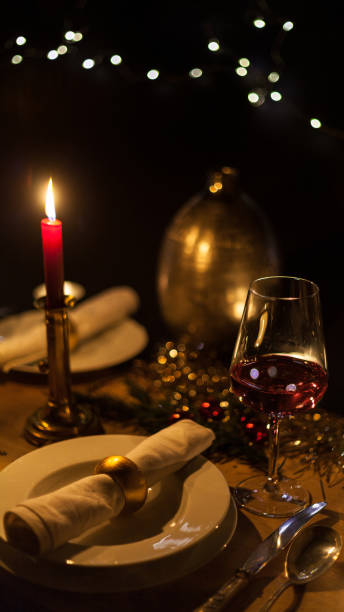 istock Christmas dinner with romantic candlelight and Christmas decorations 1187836498