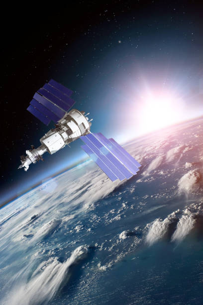 istock Space satellite solar panels orbiting the earth during sunset and bright rays lights. Elements of this image furnished by NASA. 1187837084