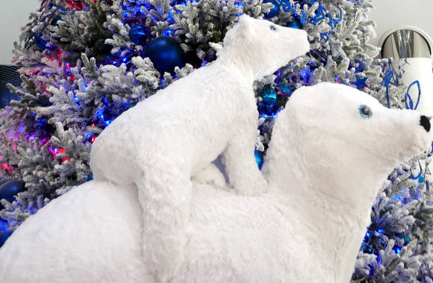 istock Decorative polar bears and Christmas tree. 1187838684