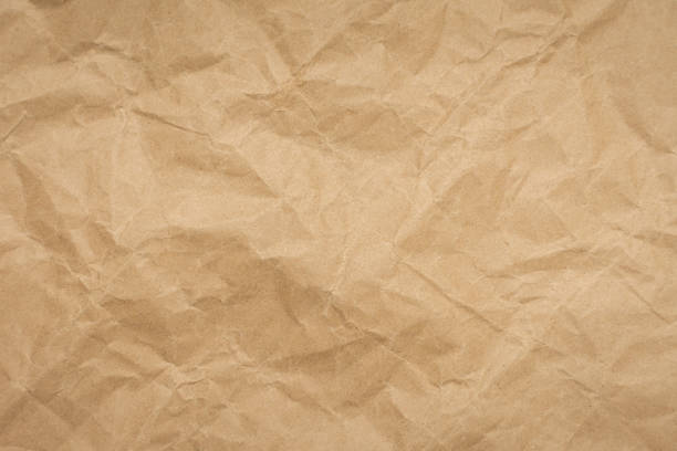 istock Crumpled brown paper texture vintage background. 1187839775