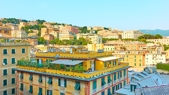 Panorama of Genoa city with residential buildings in the evening, Italy