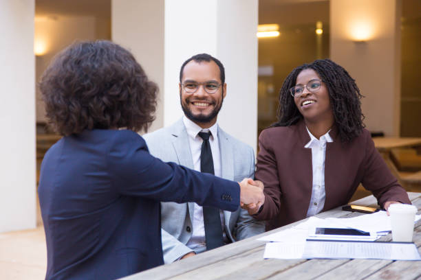 istock Happy satisfied customers thanking consultant for help 1187841319