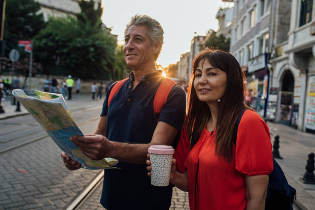 istock Mature couple on a journey looking for the direction 1187841436