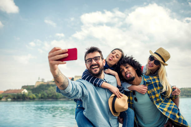 istock Group of friends making selfie 1187841600