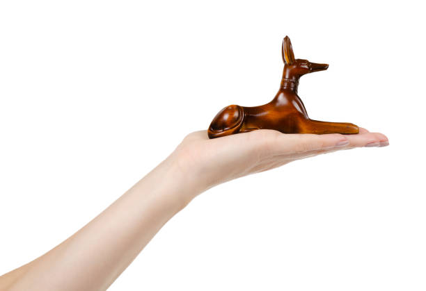 istock God Anubis figure, stone souvenir. Isolated on white. 1187841754