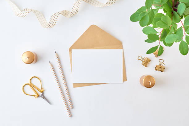 istock Mockup white greeting card and envelope with branches with green leaves on a light background 1187845264