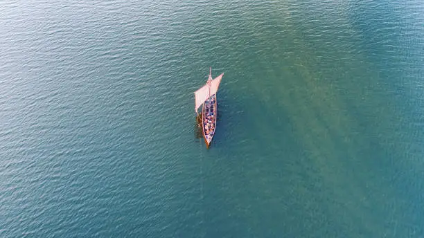 Viking ship at sea, Roskilde Fjord, Denmark. Image taken with a drone.