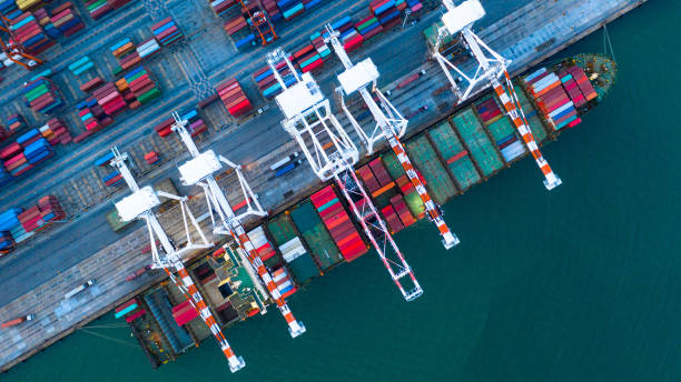istock Container ship carrying container for business freight shipping import and export, Aerial view container ship arriving in commercial port. 1187848353