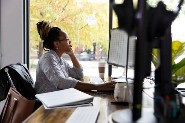 istock Business woman works on budget numbers using desktop 1187848618
