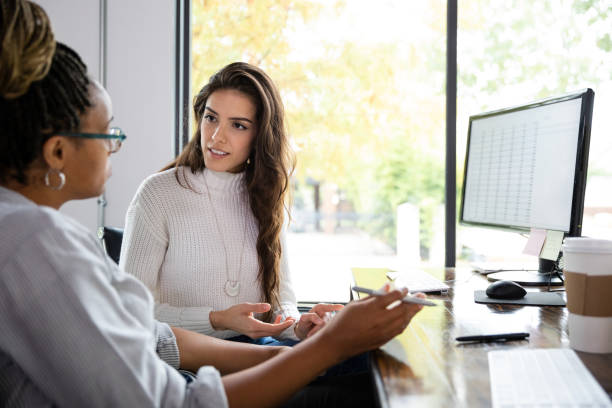 istock Female small business owners discuss business issues 1187848634