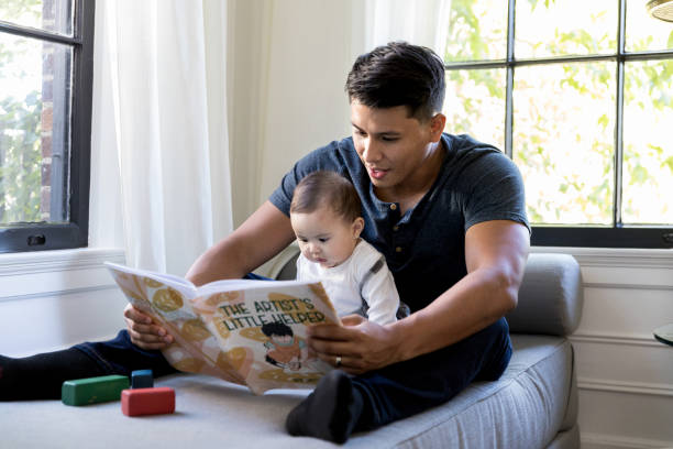 istock During playtime, father and daughter read book together 1187848766