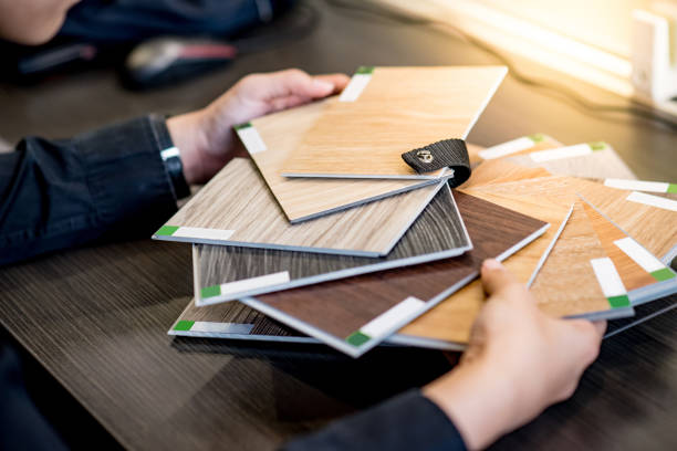 istock Asian architect man choosing wooden color swatch 1187850251