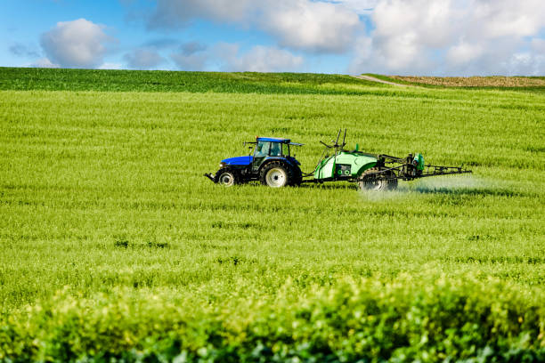 istock farmer spraying his fields in autumn 1187851505