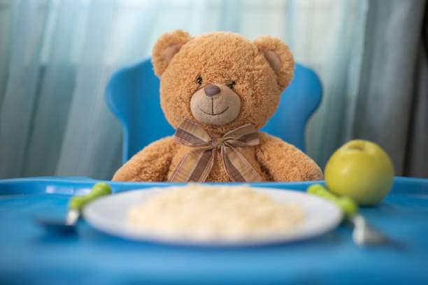 Teddy bear eating porridge