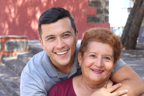 mother and son together outdoors - life events laughing women latin american and hispanic ethnicity imagens e fotografias de stock