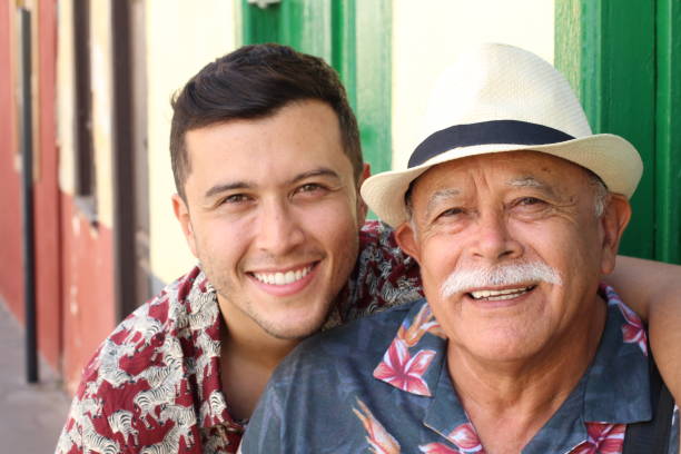 Father and son laughing outdoors Father and son laughing outdoors. puerto rican ethnicity stock pictures, royalty-free photos & images